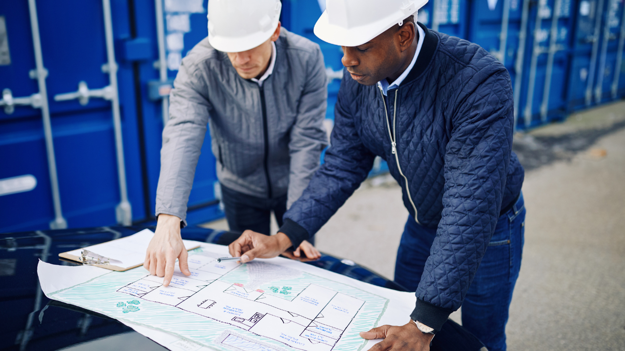 construction workers reviewing documents